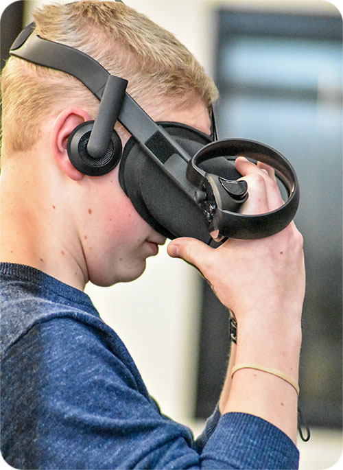 Student wearing VR gear Student wearing VR gear